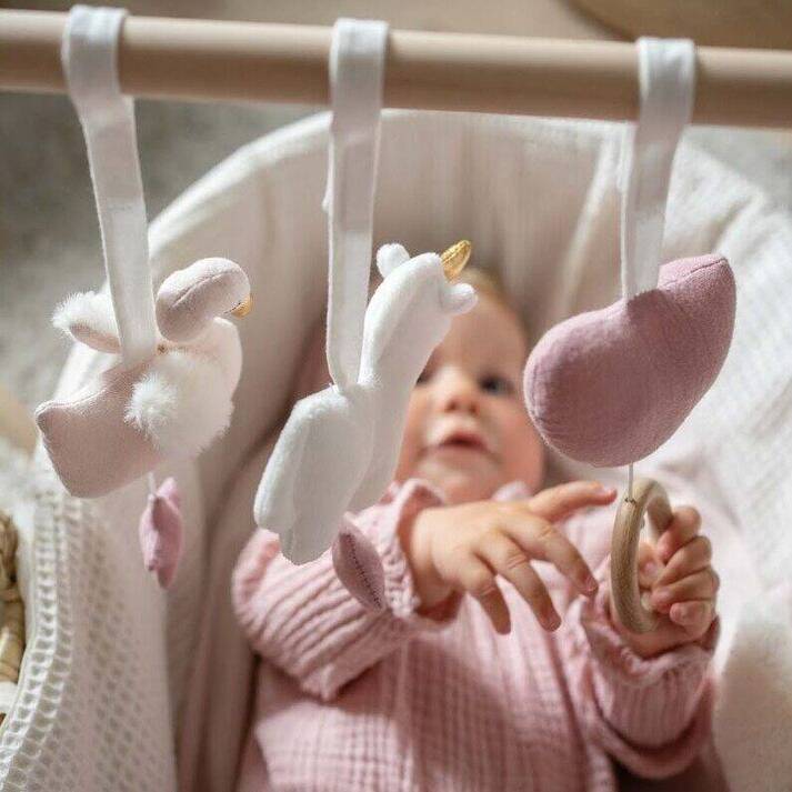 Jabadabadoo_wooden-Baby-Gym-toys-and-swans-hanging-in-cot